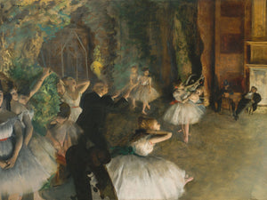 19th-century Impressionist painting by Edgar Degas showing ballet dancers rehearsing on stage, highlighting elegance and motion in a classic theatrical setting.