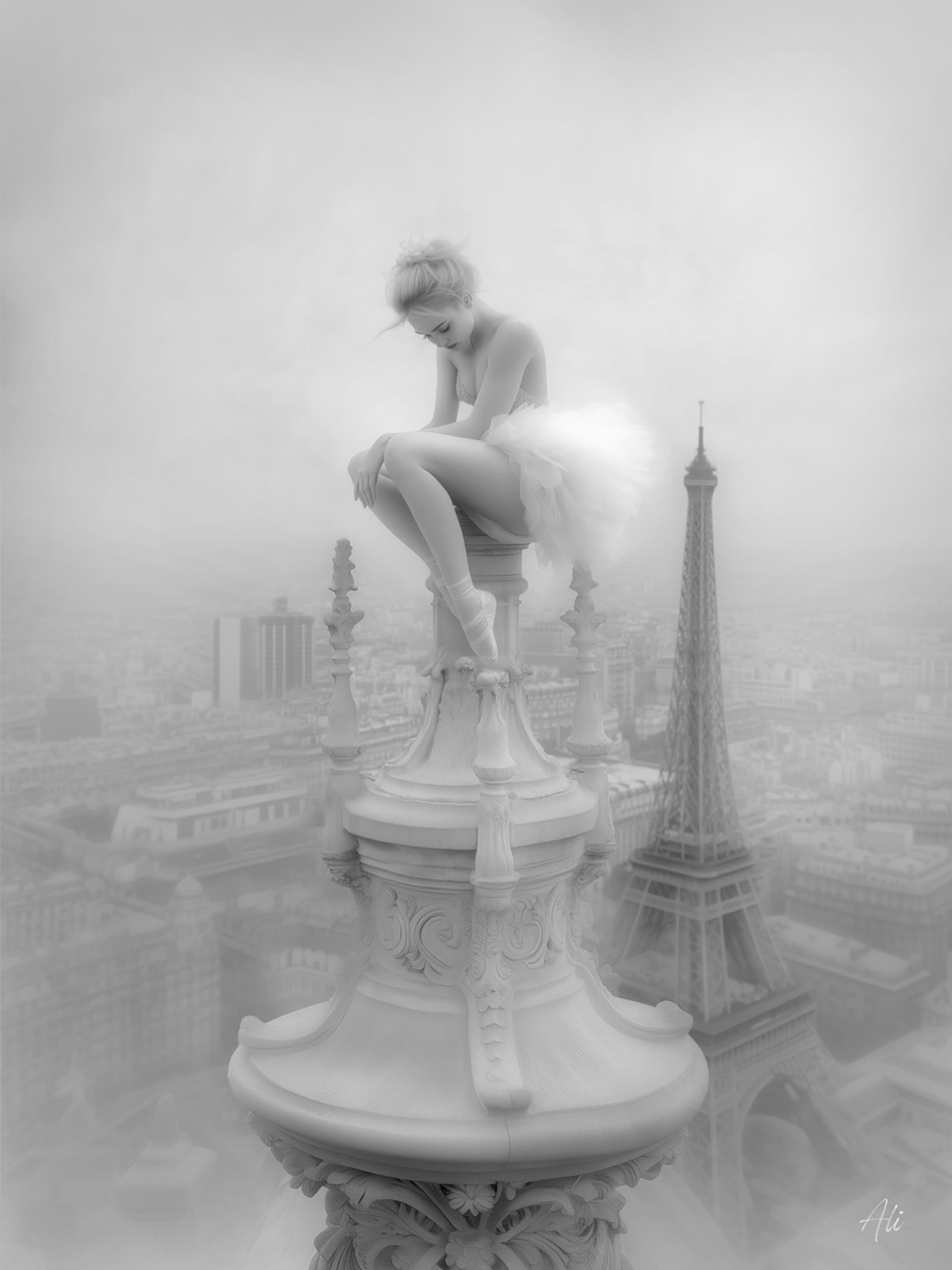 Black and white fine art photograph of a ballerina sitting pensively on a decorative Parisian spire, with the Eiffel Tower and city skyline visible below, captured with vintage-inspired contrast and ethereal lighting that emphasizes the dreamlike quality of the scene.