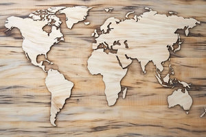 World map artwork featuring carved continents on a wooden background, showcasing intricate craftsmanship in black, brown, and beige tones for a natural and educational decor.