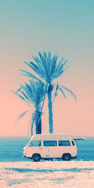 Tropical artwork showcasing a vintage camper on a sandy beach, surrounded by palm trees and a tranquil turquoise ocean, evoking a sense of leisure, adventure, and wanderlust.