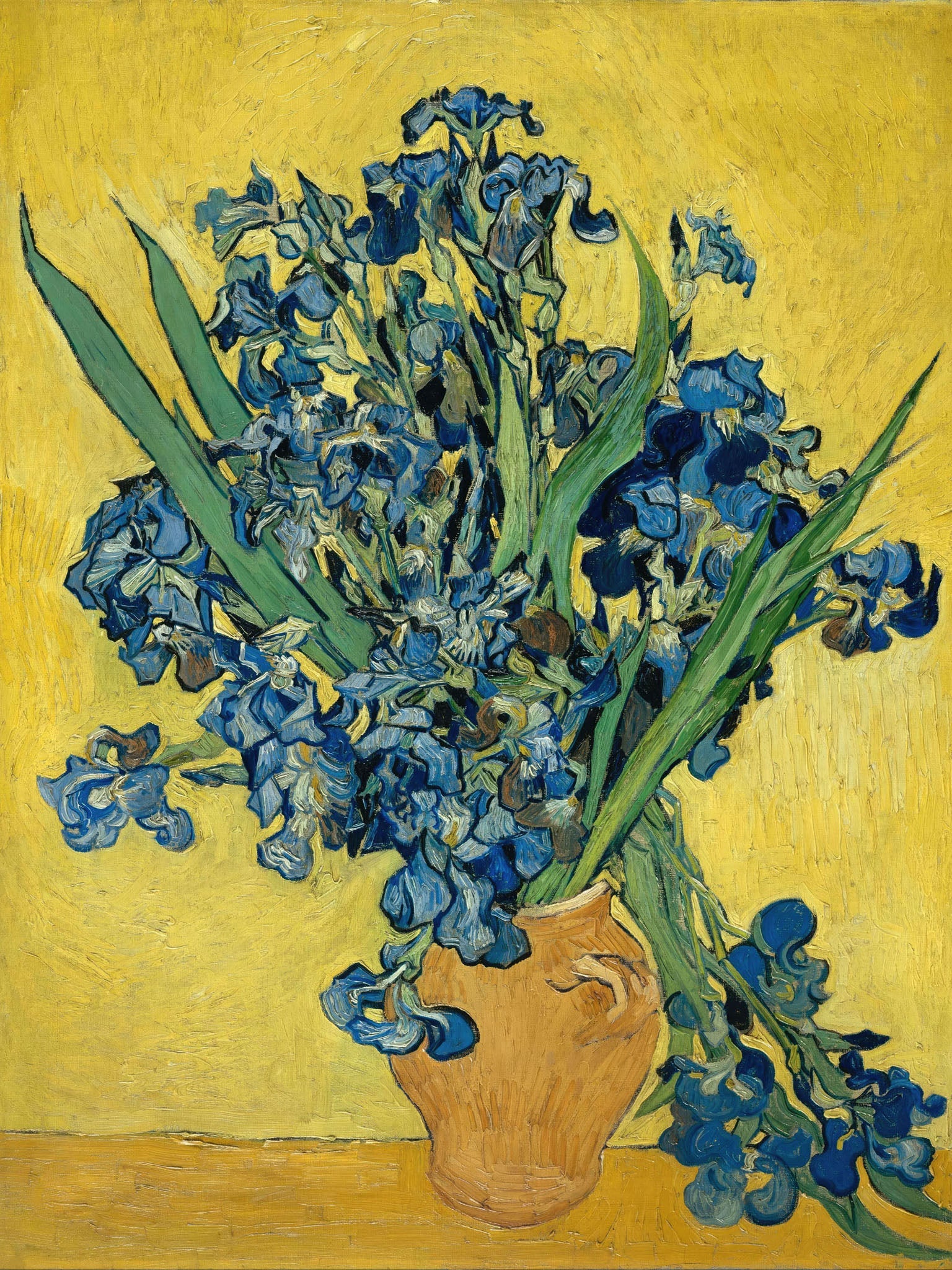 Vincent Van Gogh's "Irises," a vibrant Post-Impressionist still life featuring bold strokes of blue, green, and yellow with luxuriant blooms in a yellow vase.