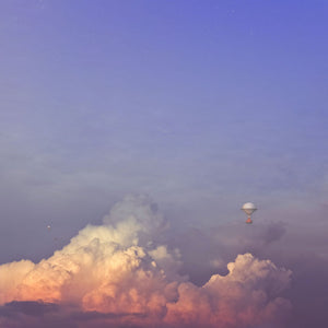 Fantasy illustration of a vintage airship floating through a tranquil evening sky with purple, pink, and rose gold hues, evoking serenity, calm, and adventure.