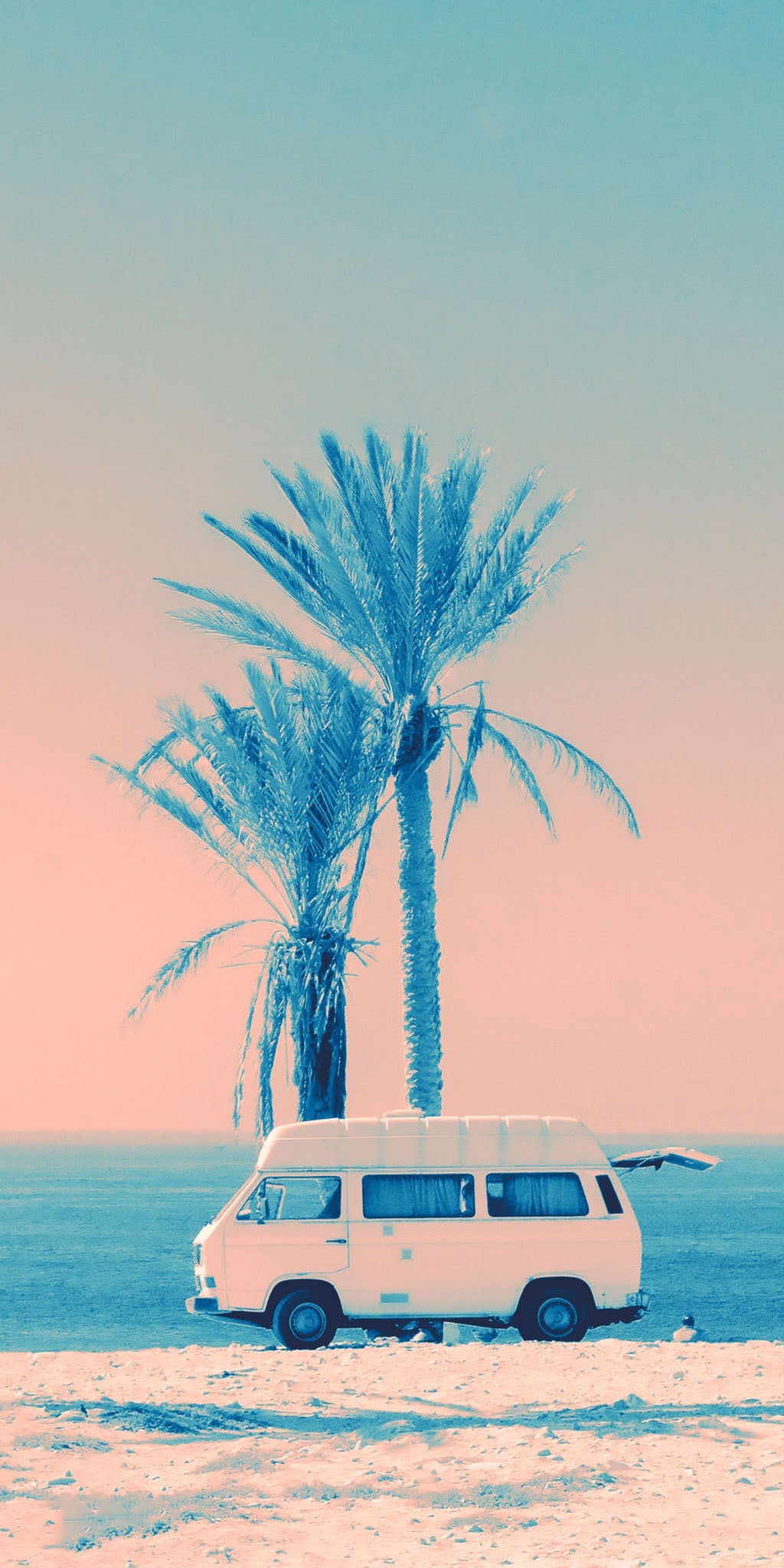 Tropical artwork showcasing a vintage camper on a sandy beach, surrounded by palm trees and a tranquil turquoise ocean, evoking a sense of leisure, adventure, and wanderlust.